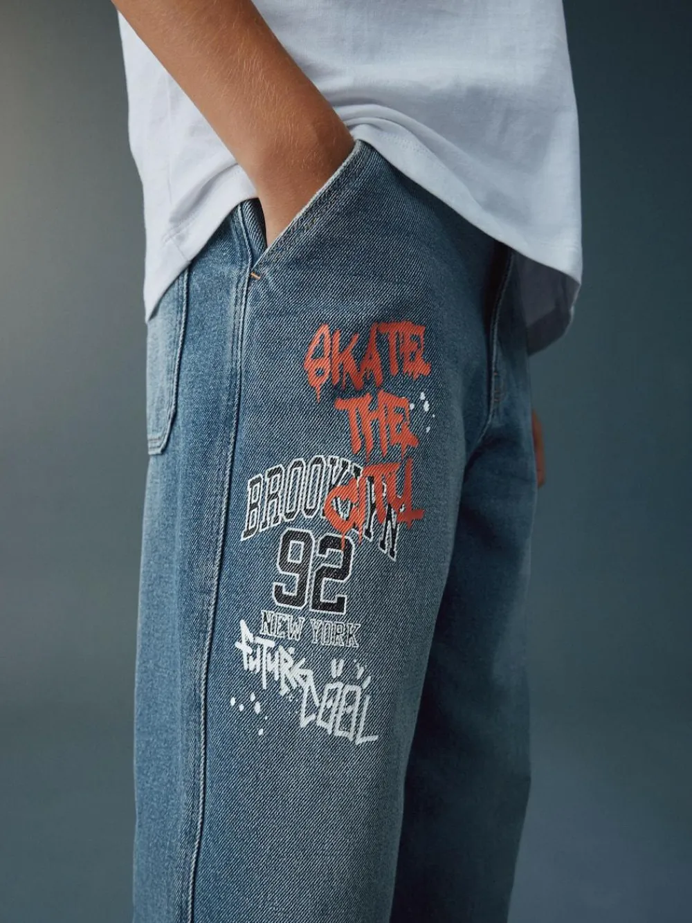 Next Varsity All-Over Print Mid Blue Denim Wide Fit Authentic Jeans (3-16yrs)^BOY Jeans|Jeans